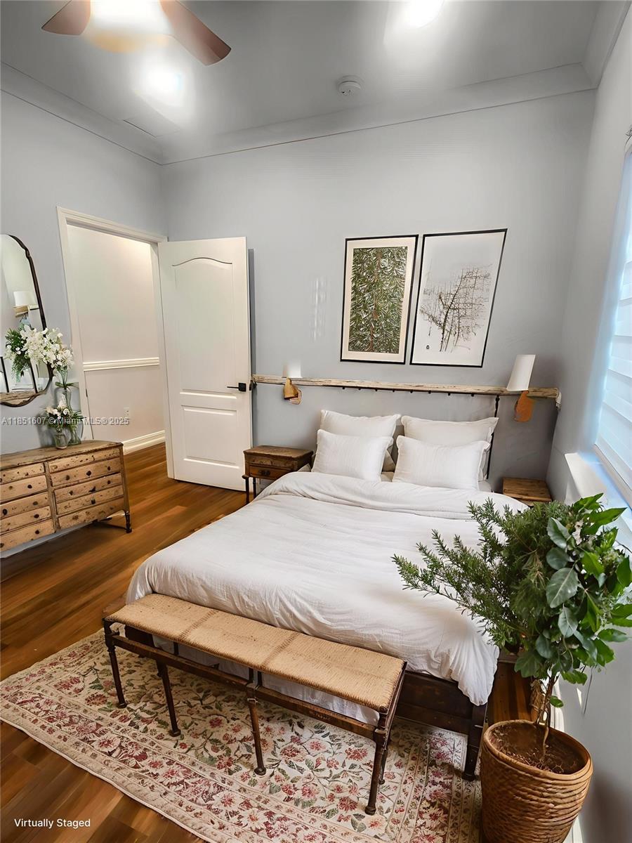 17833 Southwest 155th Court Miami, FL 33187 - Photo 12 of 22 a living room with furniture and a potted plant