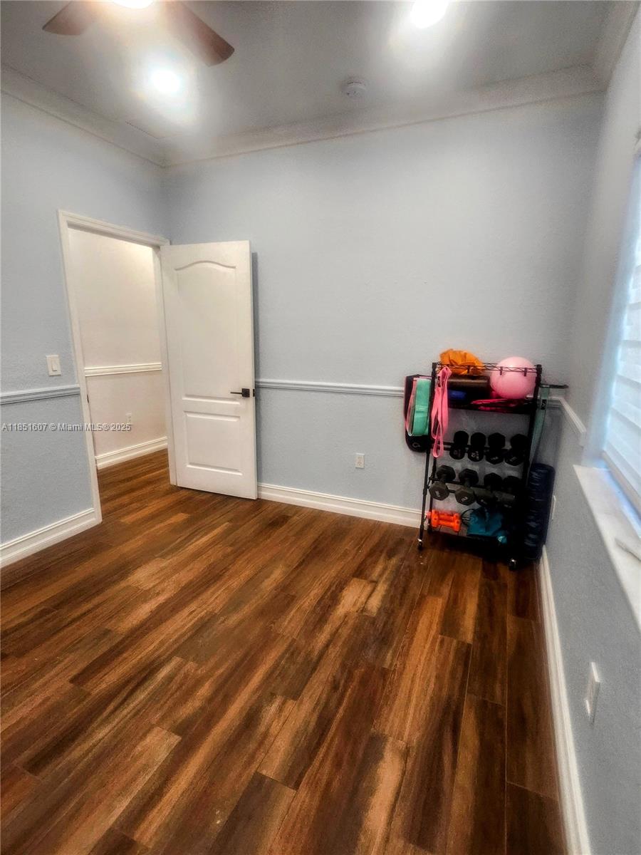 17833 Southwest 155th Court Miami, FL 33187 - Photo 13 of 22 a view of a room with wooden floor