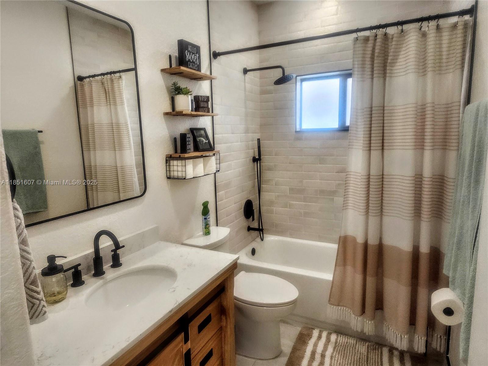 17833 Southwest 155th Court Miami, FL 33187 - Photo 14 of 22 a bathroom with a sink toilet and shower