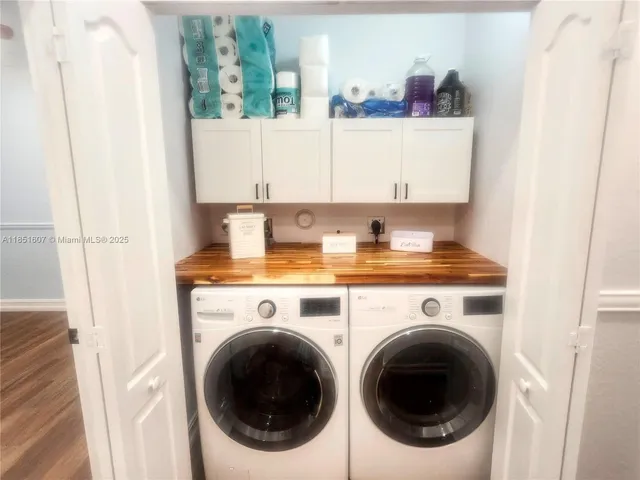 a view of a kitchen with washer and dryer