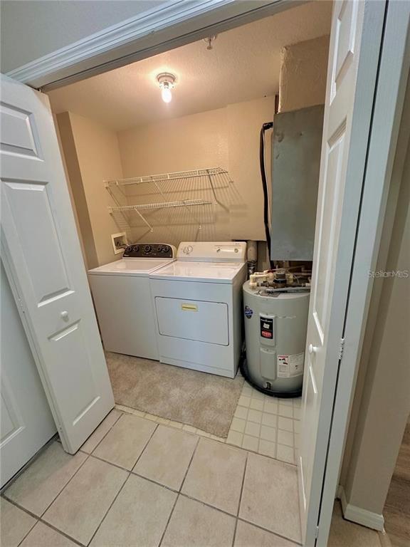 3280 Soho Street, Unit 307 Orlando, FL 32835 - Photo 19 of 34 a room with a stove and a refrigerator