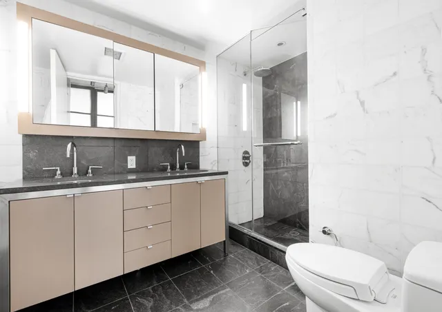 a kitchen with kitchen island a counter top space and a refrigerator