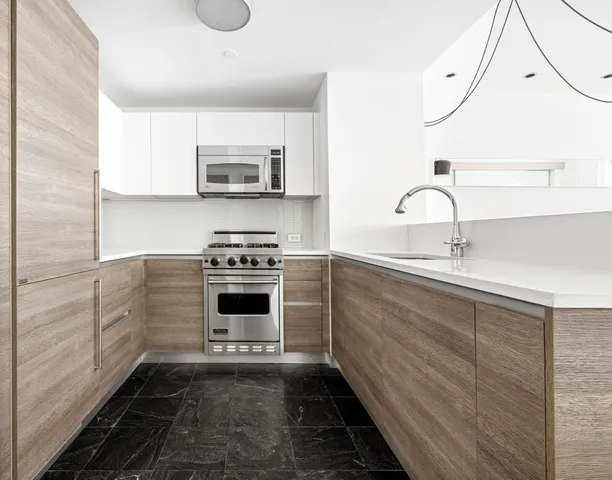 a bathroom with a tub and a view of bathroom