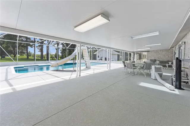 a view of a chair and table in the patio
