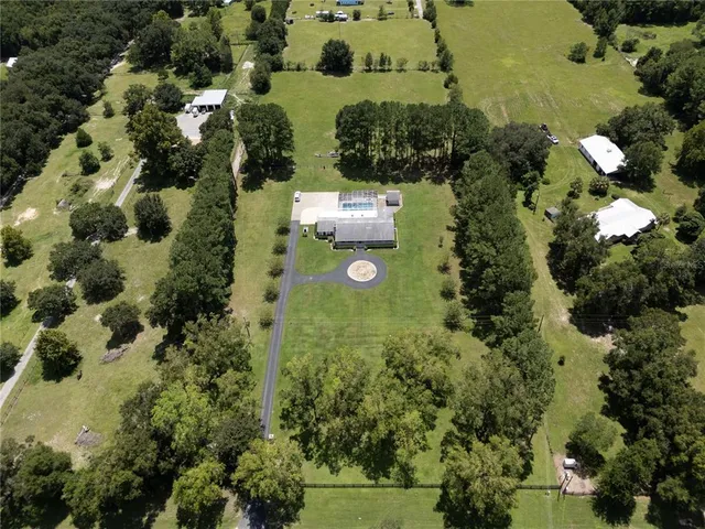 a living room with fireplace furniture and a flat screen tv