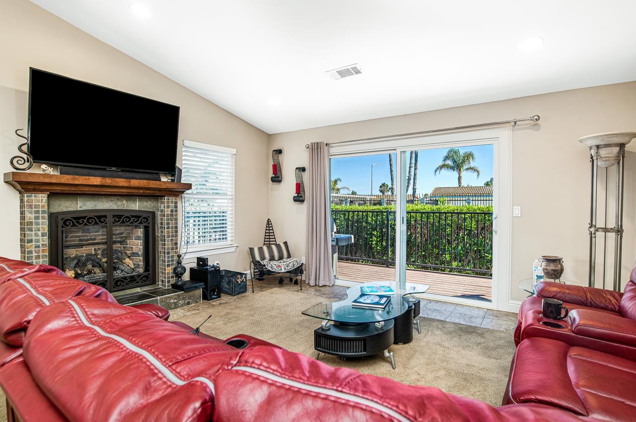 5644 Schooner Loop Discovery Bay, CA 94505 - Photo 18 of 42 a living room with furniture fireplace and flat screen tv