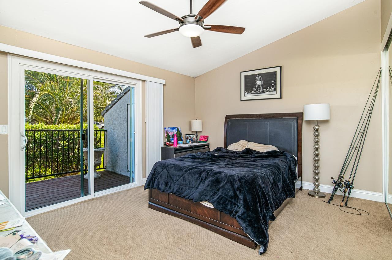 5644 Schooner Loop Discovery Bay, CA 94505 - Photo 24 of 42 a bedroom with a large bed and a window