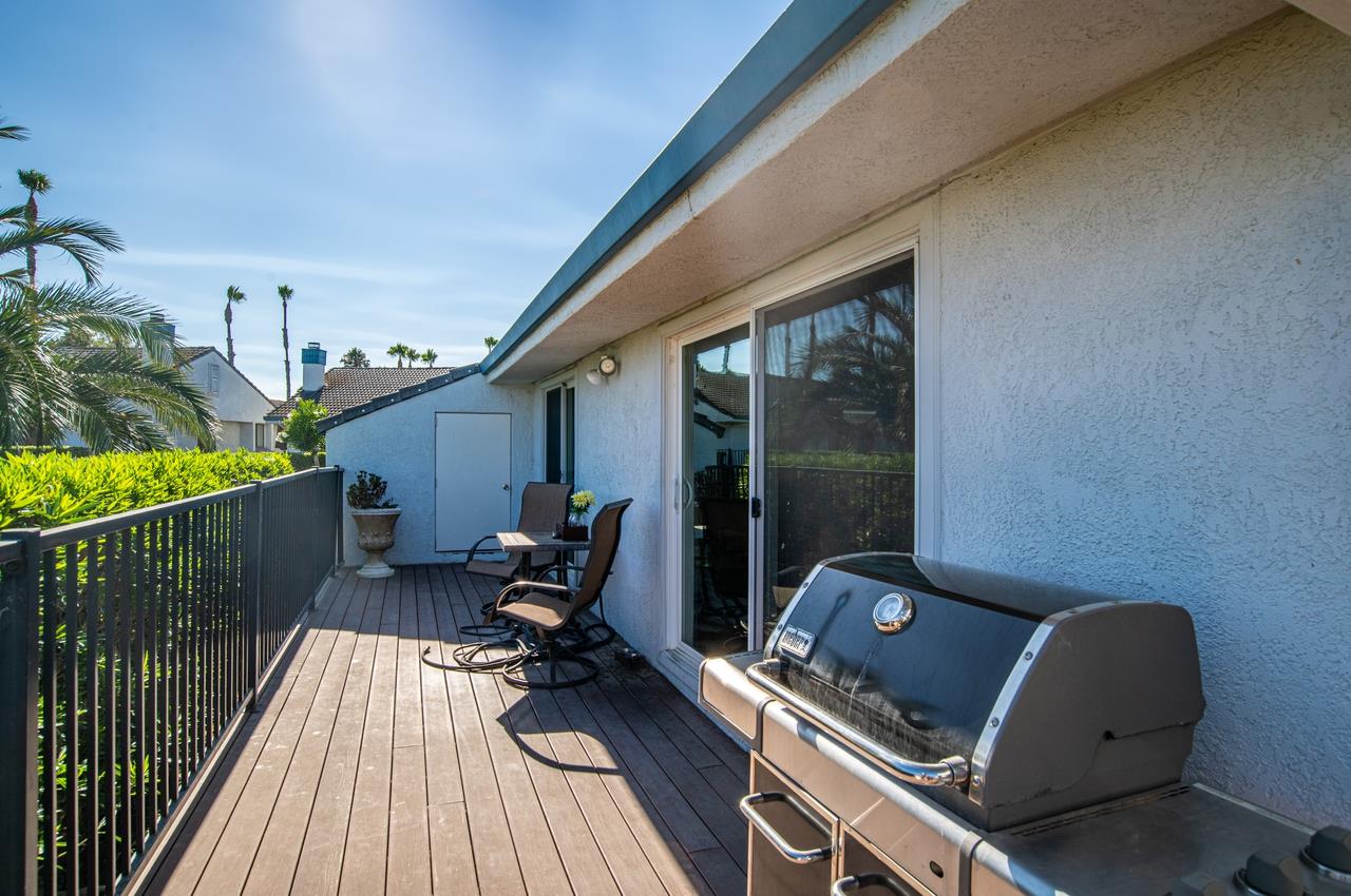5644 Schooner Loop Discovery Bay, CA 94505 - Photo 30 of 42 a balcony with wooden floor table and chairs
