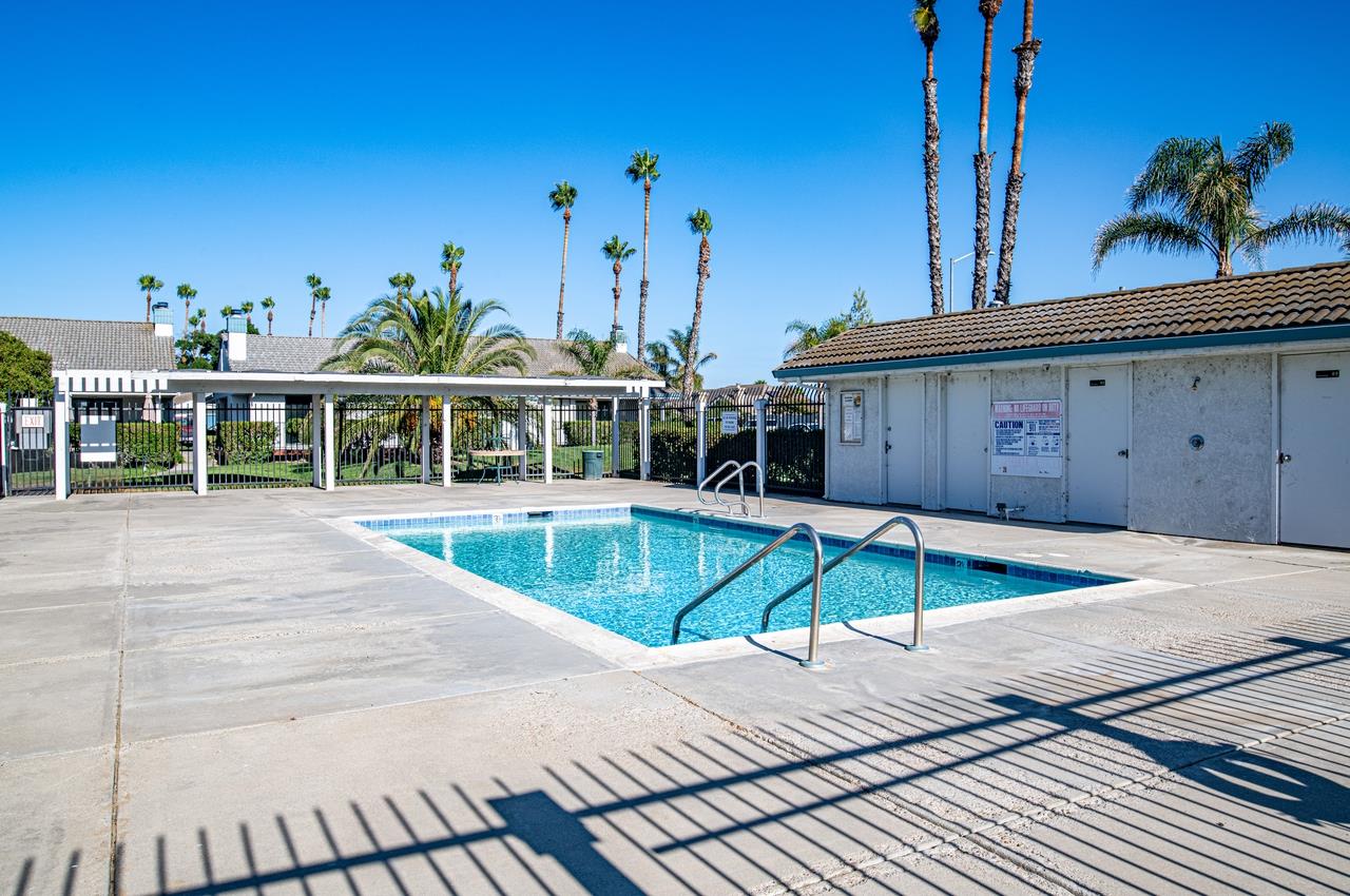 5644 Schooner Loop Discovery Bay, CA 94505 - Photo 34 of 42 a view of a house with a swimming pool