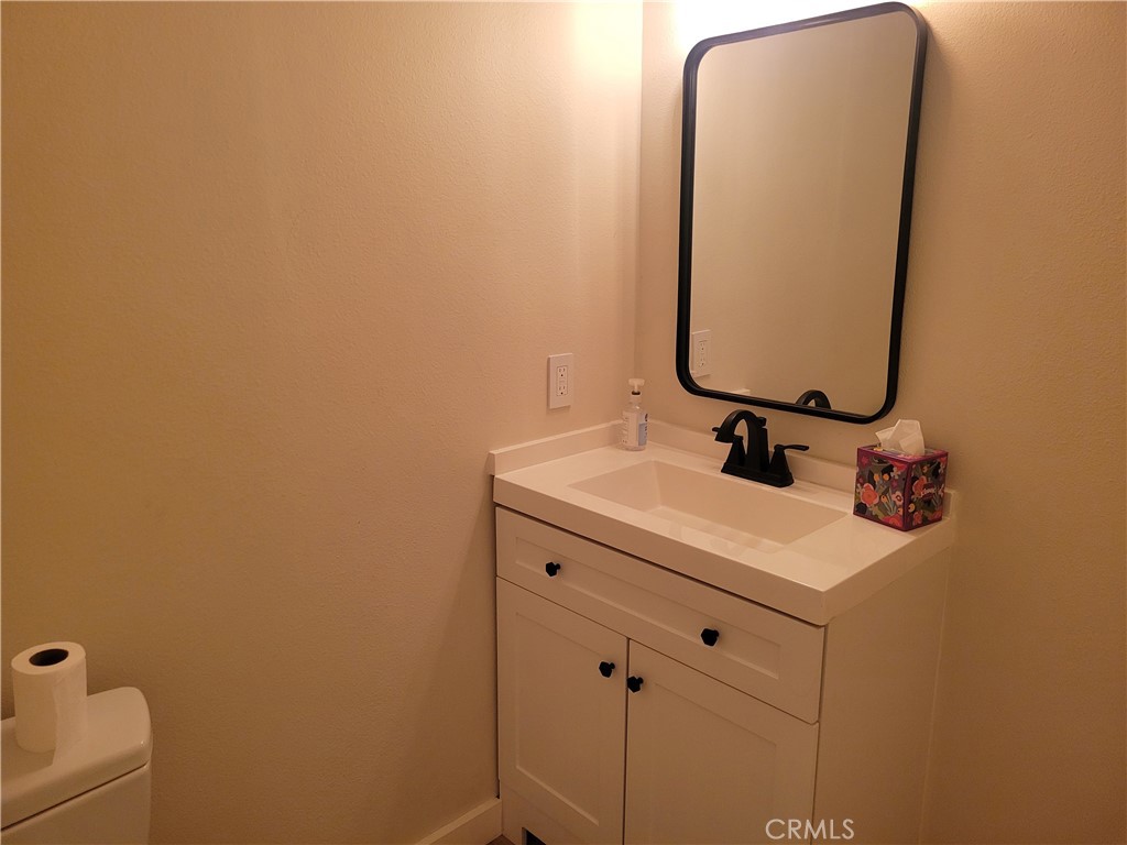 11 Meadowsweet Way Irvine, CA 92612 - Photo 11 of 35 a bathroom with a sink and mirror