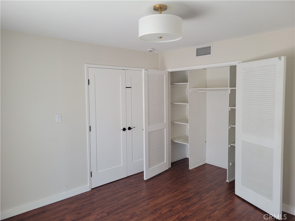 11 Meadowsweet Way Irvine, CA 92612 - Photo 12 of 35 an empty room with wooden floor and a ceiling fan