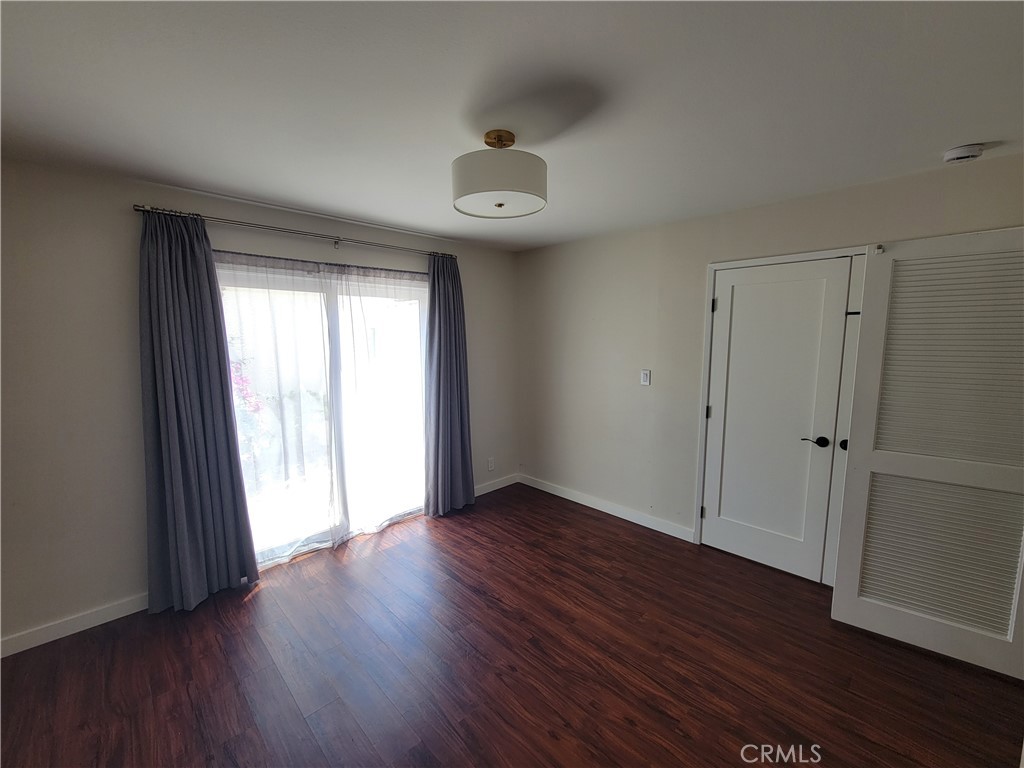 11 Meadowsweet Way Irvine, CA 92612 - Photo 13 of 35 a view of an empty room with wooden floor and a window