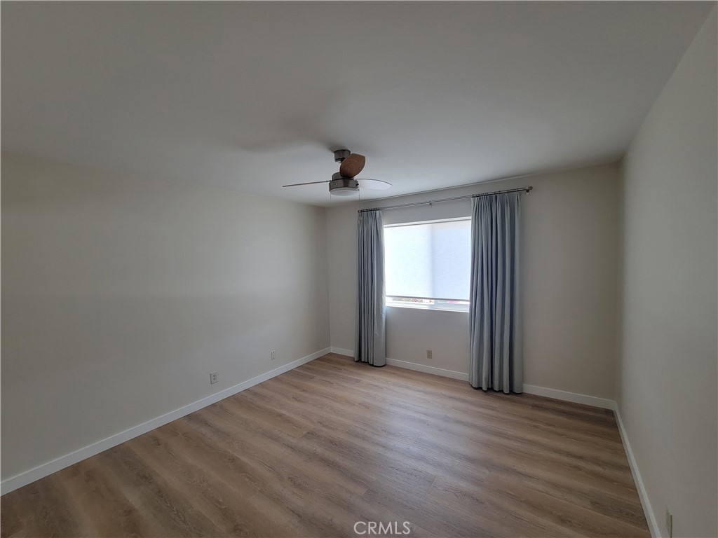 11 Meadowsweet Way Irvine, CA 92612 - Photo 16 of 35 an empty room with wooden floor and windows