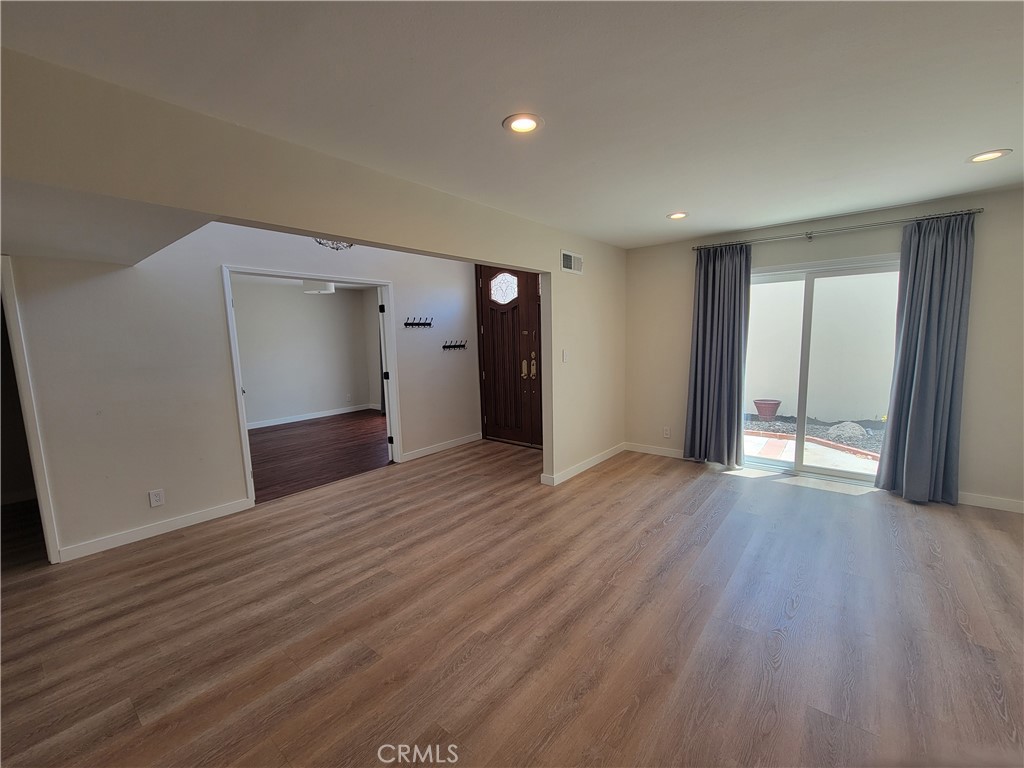 11 Meadowsweet Way Irvine, CA 92612 - Photo 5 of 35 a view of an empty room with wooden floor and closet