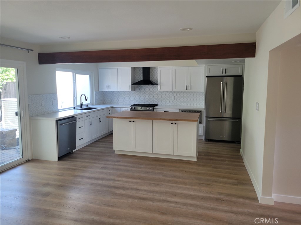 11 Meadowsweet Way Irvine, CA 92612 - Photo 7 of 35 a kitchen with stainless steel appliances granite countertop a stove top oven a sink and a refrigerator