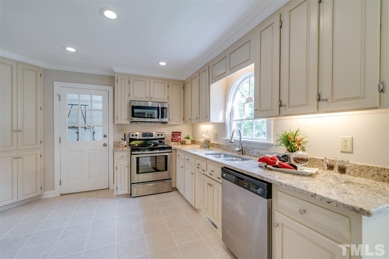 3905 Inland Court Raleigh, NC 27606 - Photo 5 of 24 Beautifully renovated eat-in Kitchen features brand new granite counter tops, stainless steel appliances and Tile floors.
