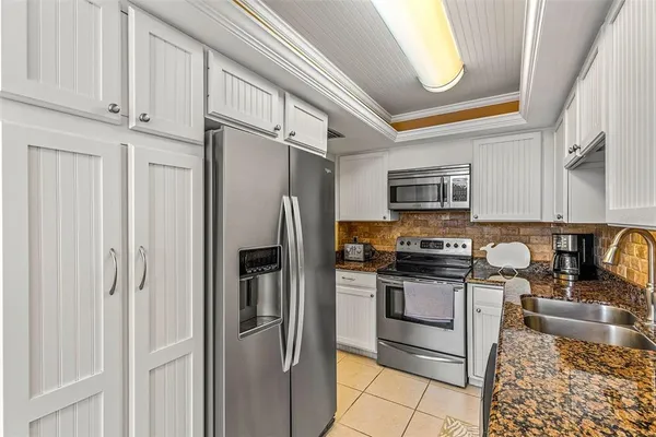 $400,000 | 9495 Blind Pass Road, Unit 202, St. Pete Beach, FL 33706