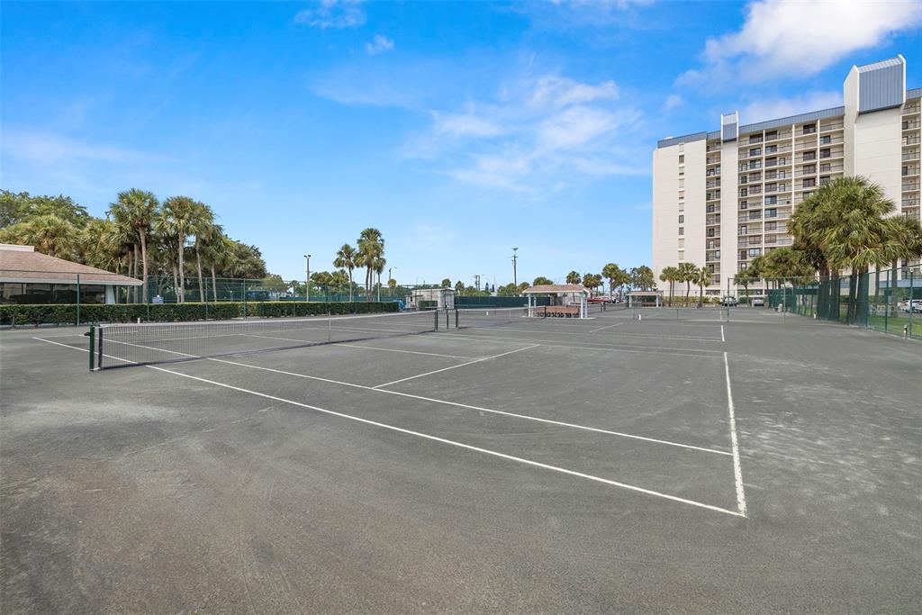 9495 Blind Pass Road, Unit 202 St. Pete Beach, FL 33706 - Photo 27 of 55 a view of tennis court