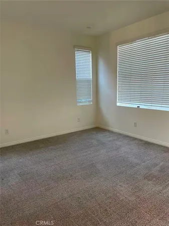 a kitchen with a sink a refrigerator and cabinets