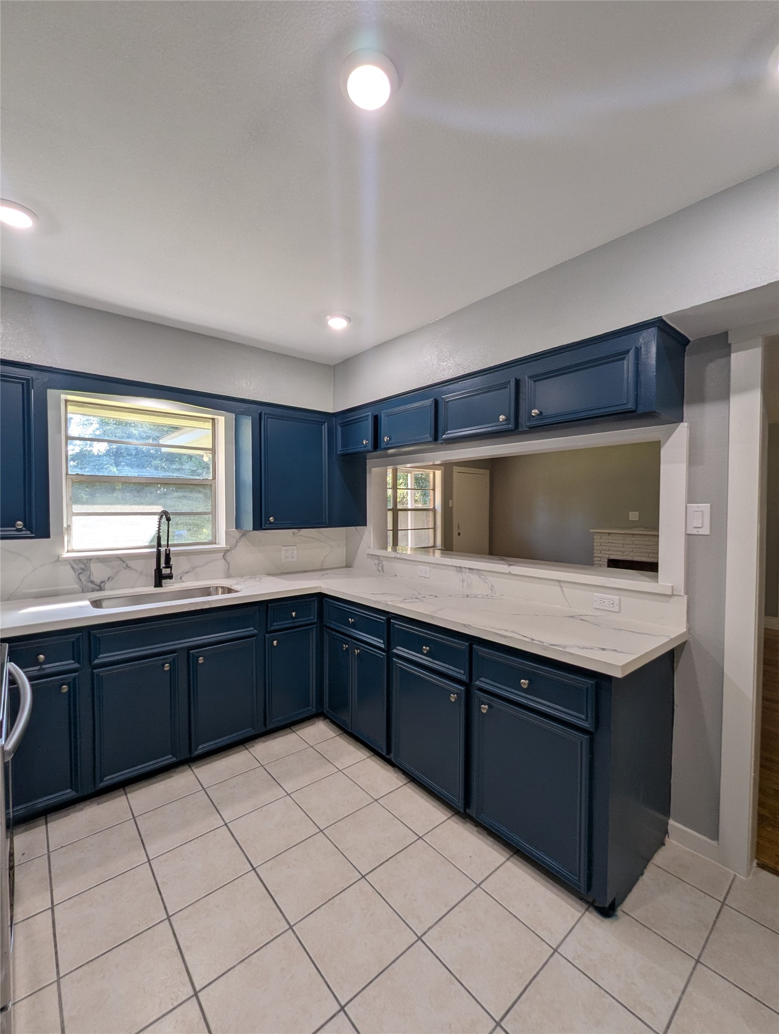 12633 Arp Street Houston, TX 77085 - Photo 2 of 11 a kitchen with a sink and cabinets