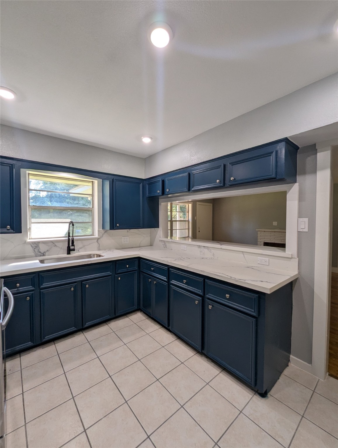12633 Arp Street Houston, TX 77085 - Photo 2 of 11 a kitchen with a sink and cabinets