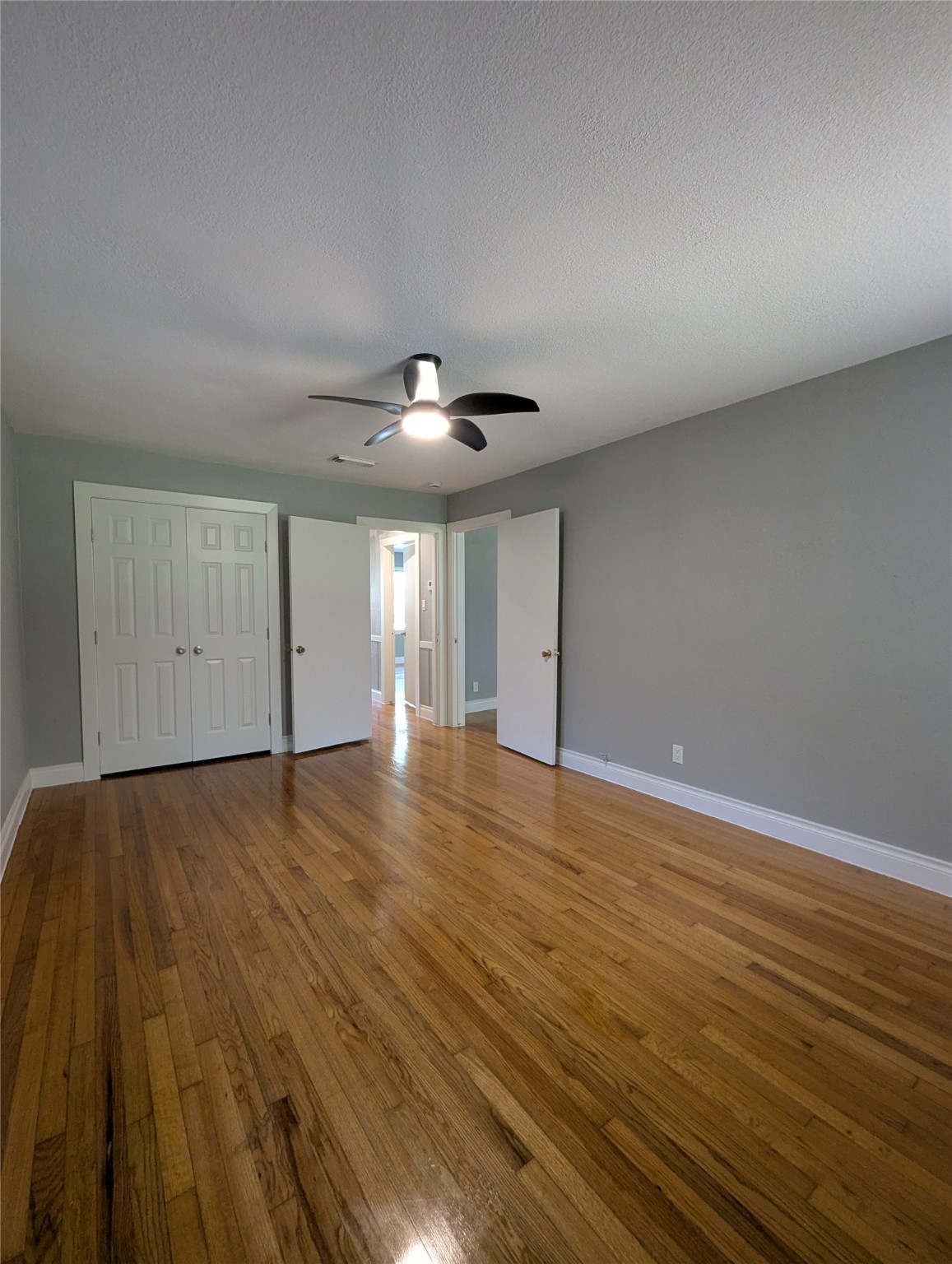 12633 Arp Street Houston, TX 77085 - Photo 8 of 11 a view of an empty room and wooden floor
