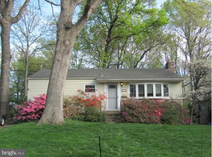 106 Oak Street Southwest Vienna, VA 22180 - Photo 1 of 1 a front view of a house with a yard and potted plants