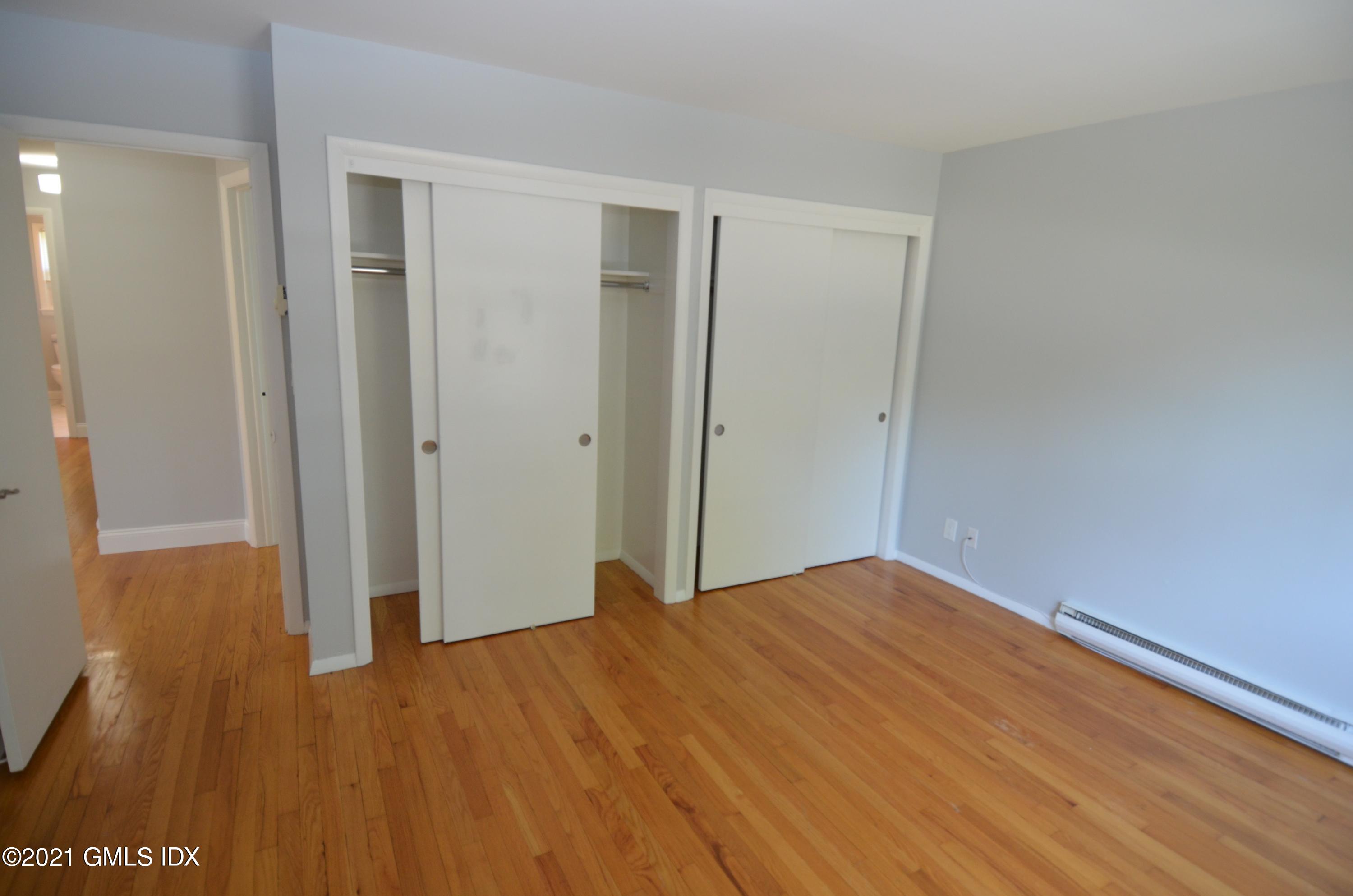 5 Ridge Place, Unit 1 Greenwich, CT 06831 - Photo 12 of 29 a view of empty room with wooden floor