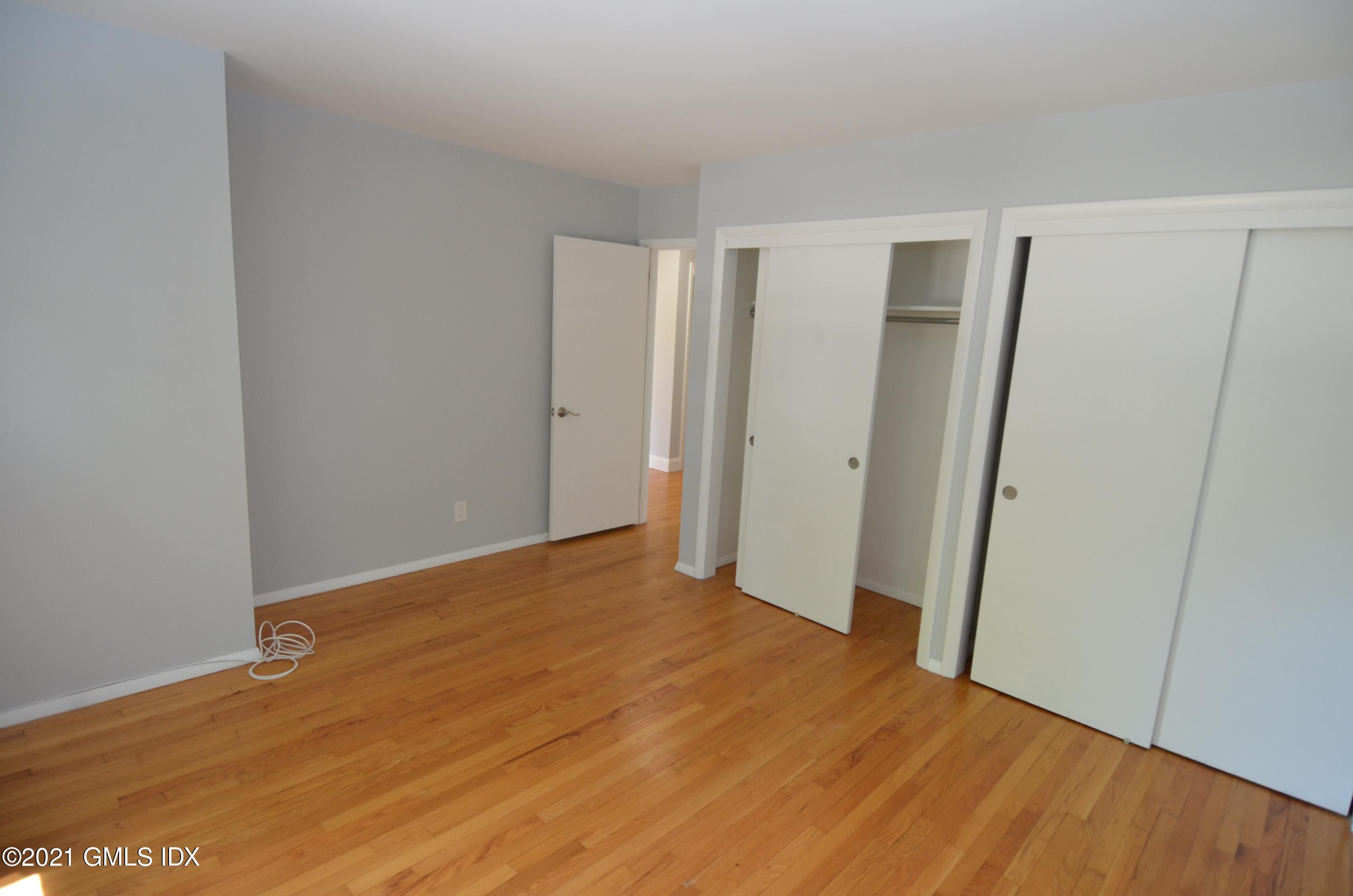 5 Ridge Place, Unit 1 Greenwich, CT 06831 - Photo 13 of 29 a view of empty room with wooden floor