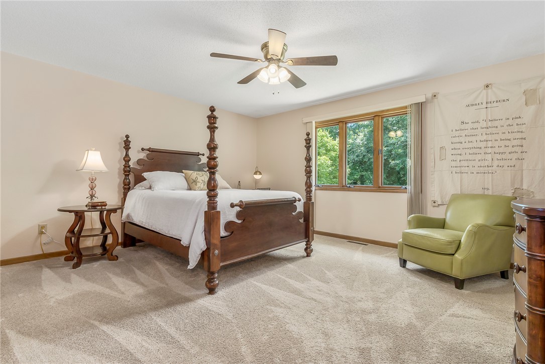 207 Laurel Ridge Road Anderson, SC 29621 - Photo 36 of 50 A tranquil primary bedroom features plush carpeting and a classic four-poster bed, offering a serene retreat.