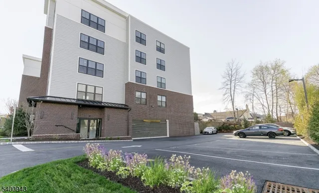 a view of a building with a yard