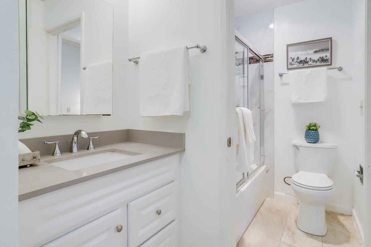 3003 Kaiser Drive, Unit D Santa Clara, CA 95051 - Photo 15 of 20 a bathroom with a granite countertop sink toilet and shower