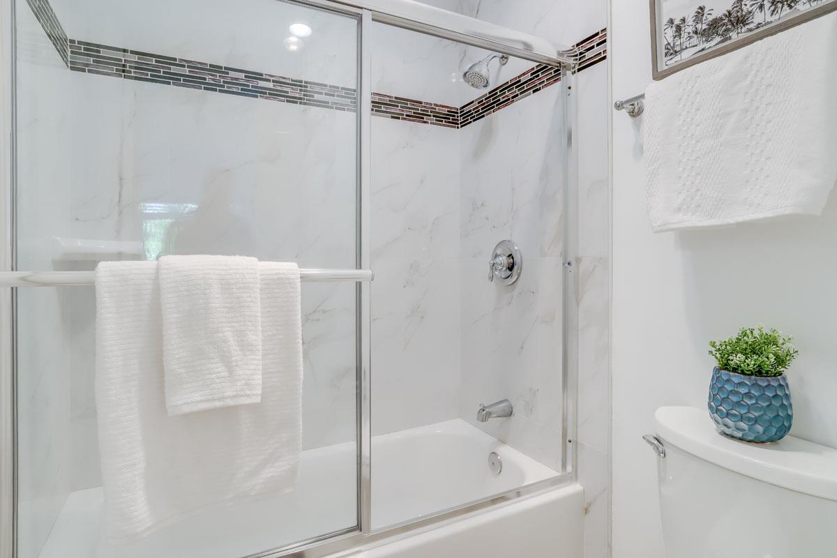 3003 Kaiser Drive, Unit D Santa Clara, CA 95051 - Photo 16 of 20 a bathroom with a bathtub and a shower