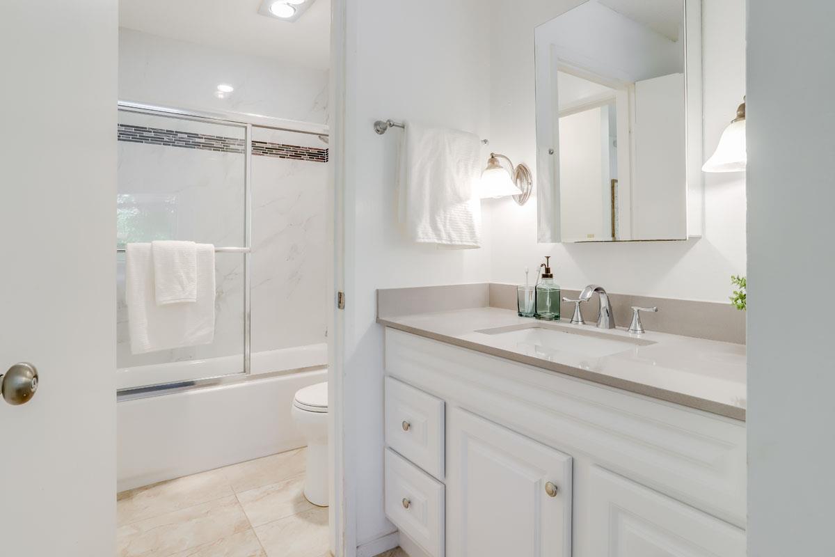 3003 Kaiser Drive, Unit D Santa Clara, CA 95051 - Photo 17 of 20 a bathroom with a granite countertop sink mirror and double