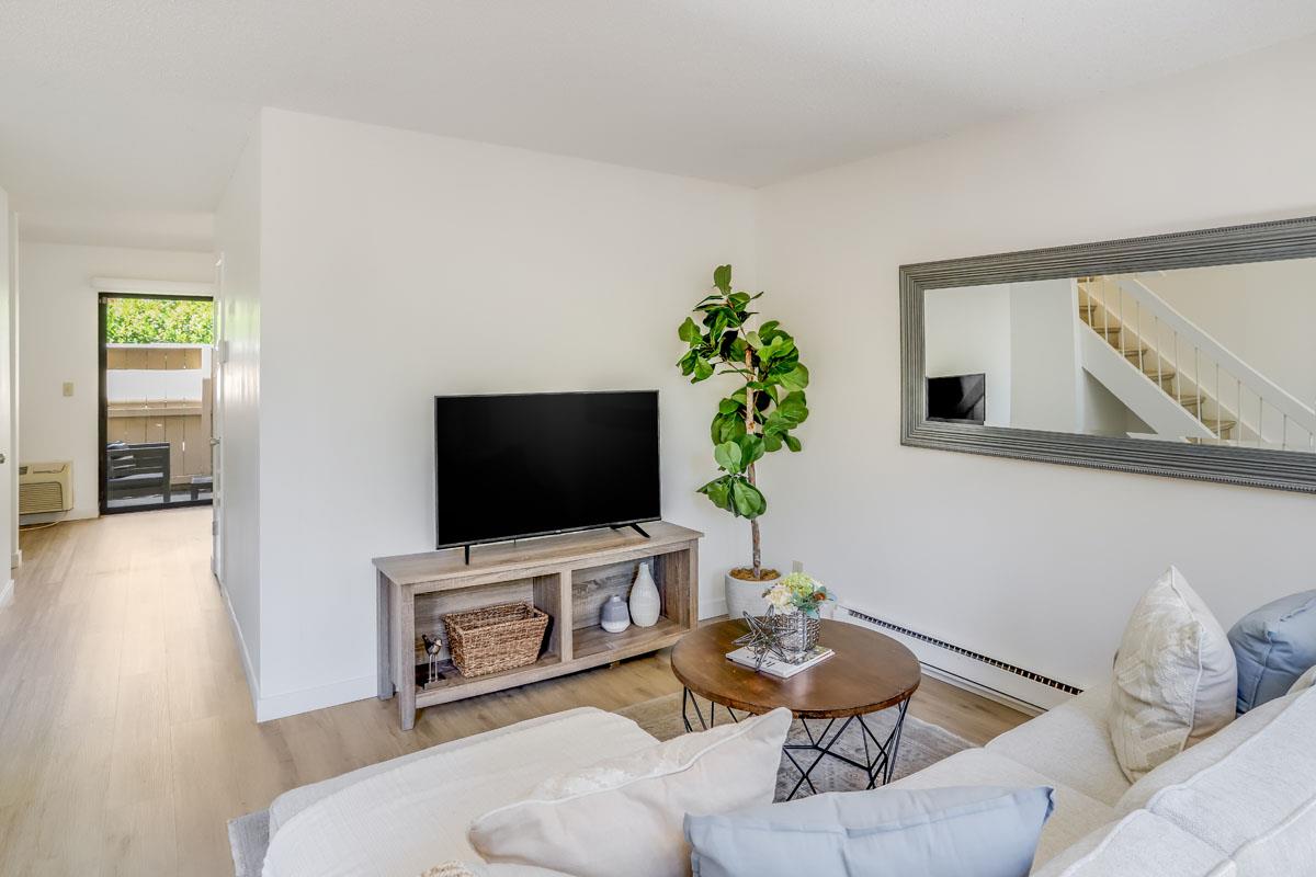 3003 Kaiser Drive, Unit D Santa Clara, CA 95051 - Photo 3 of 20 a living room with furniture and a flat screen tv