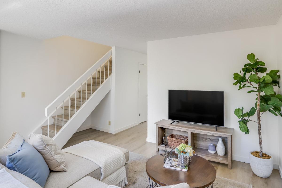 3003 Kaiser Drive, Unit D Santa Clara, CA 95051 - Photo 5 of 20 a living room with furniture and a flat screen tv