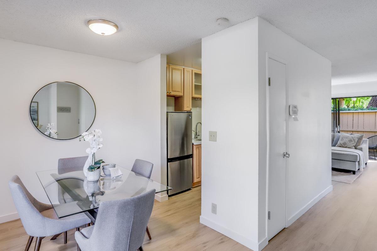 3003 Kaiser Drive, Unit D Santa Clara, CA 95051 - Photo 8 of 20 a dining room with furniture and a mirror