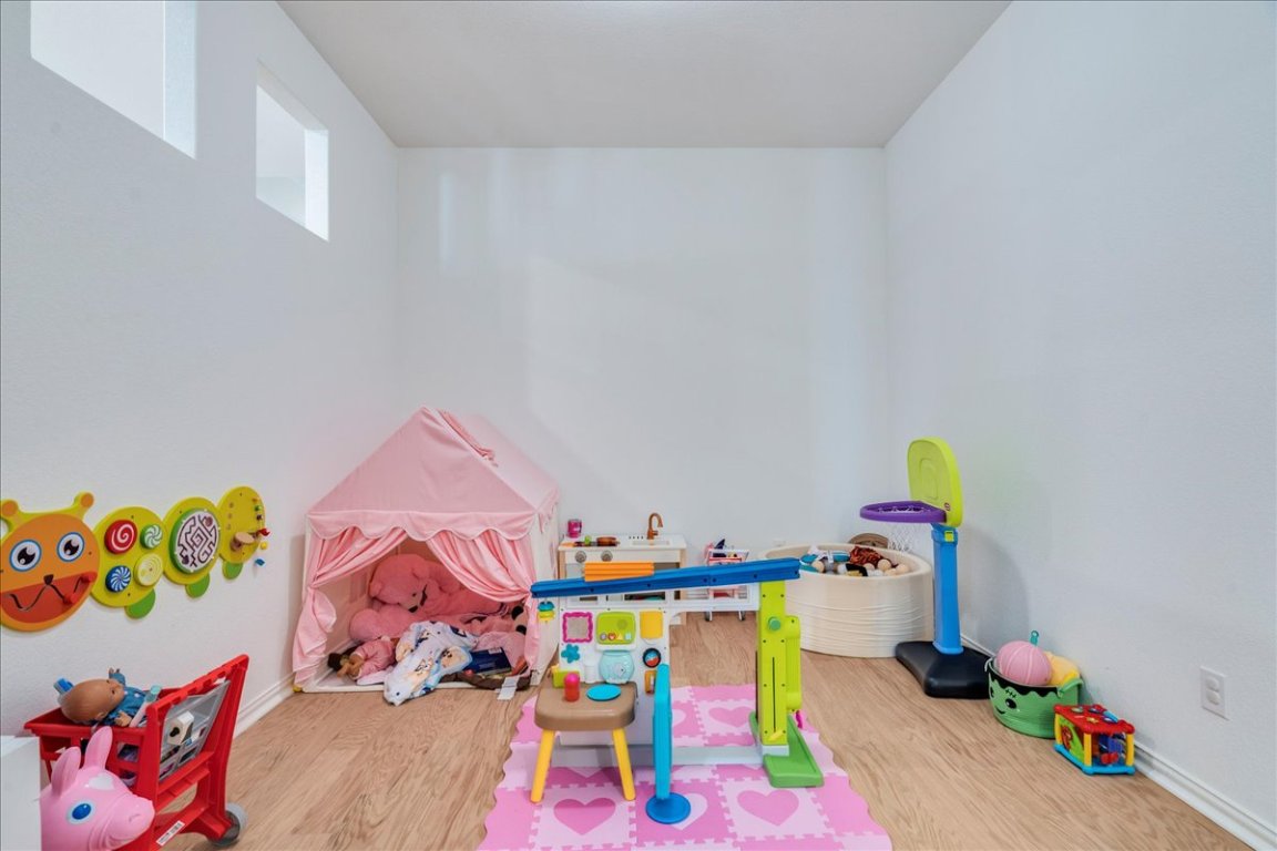 409 Durian Loop Buda, TX 78610 - Photo 15 of 30 Playroom with wood finished floors