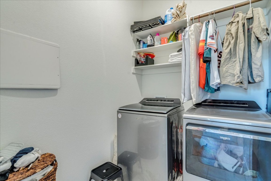 409 Durian Loop Buda, TX 78610 - Photo 24 of 30 Washroom with washer and clothes dryer
