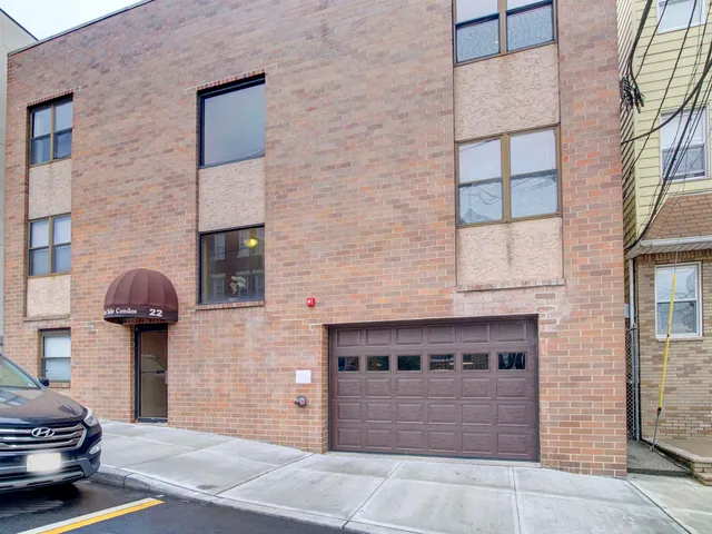 a front view of a house with garage