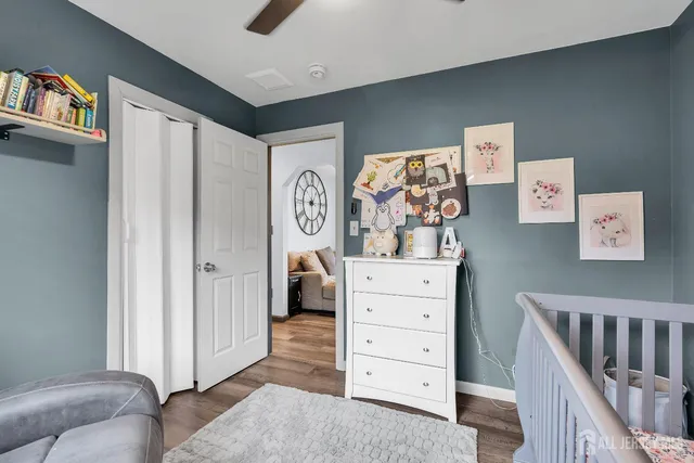a view of bedroom with furniture and closet