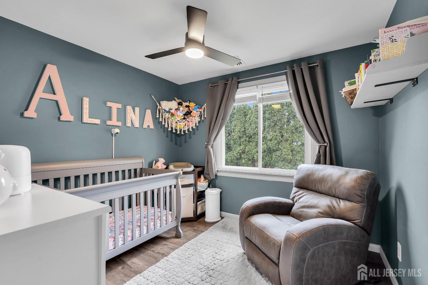 505 Summit Street Hightstown, NJ 08520 - Photo 17 of 30 a bedroom with furniture and a large window