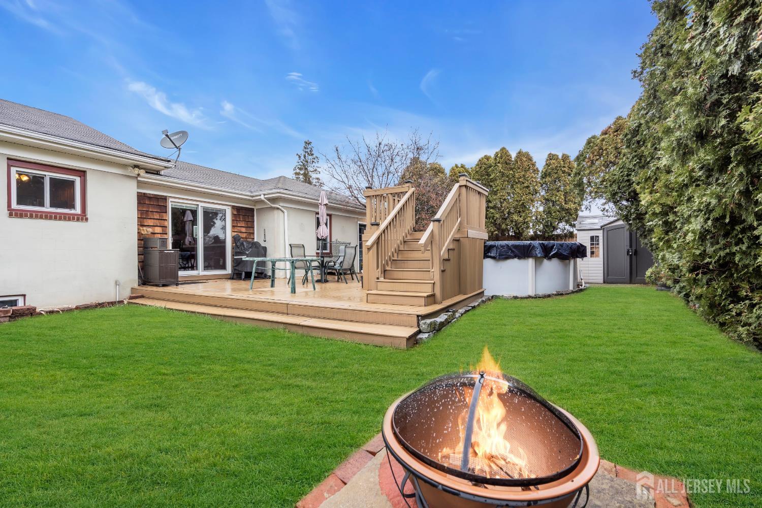 505 Summit Street Hightstown, NJ 08520 - Photo 27 of 30 a backyard of a house with table and chairs