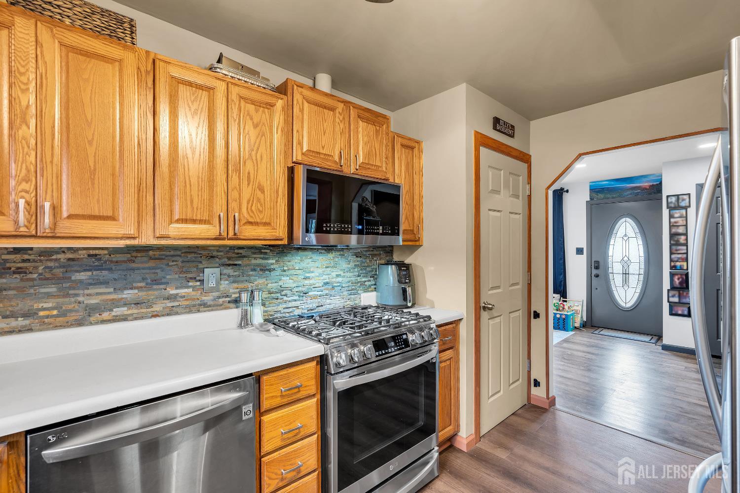 505 Summit Street Hightstown, NJ 08520 - Photo 6 of 30 a kitchen with a stove and a refrigerator