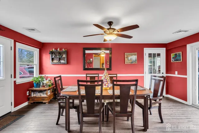 a dining room with furniture and window