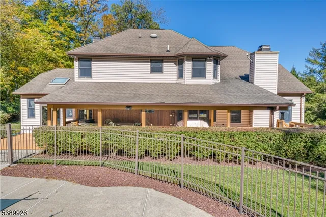 a view of a grassy field with trees in the background