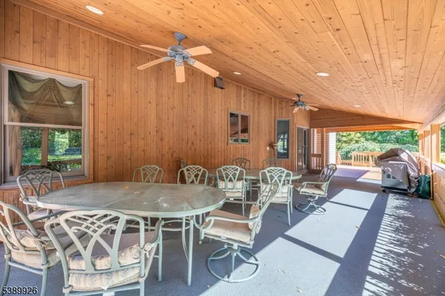 a view of an entryway with wooden floor and windows