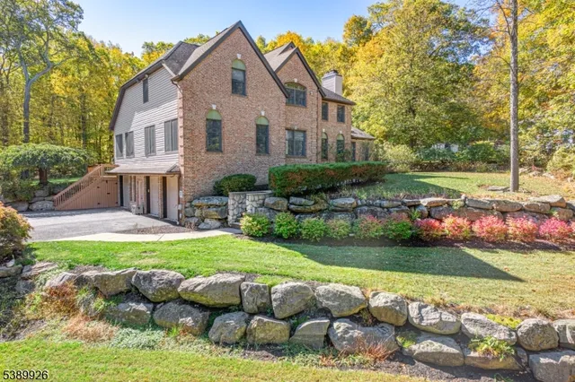 a front view of house with yard and outdoor seating