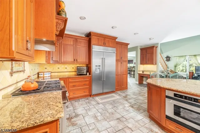 a dining room filled counter top space and a kitchen view