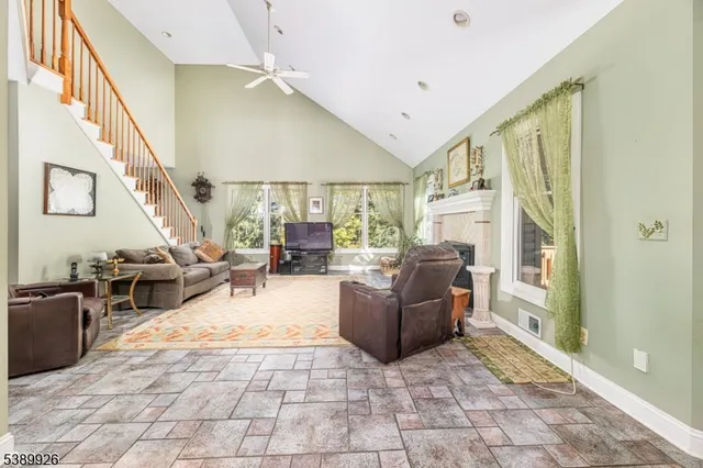 a living room with furniture and a rug